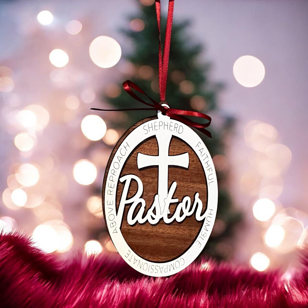 Christian clergy ornament hanging on Christmas tree lights