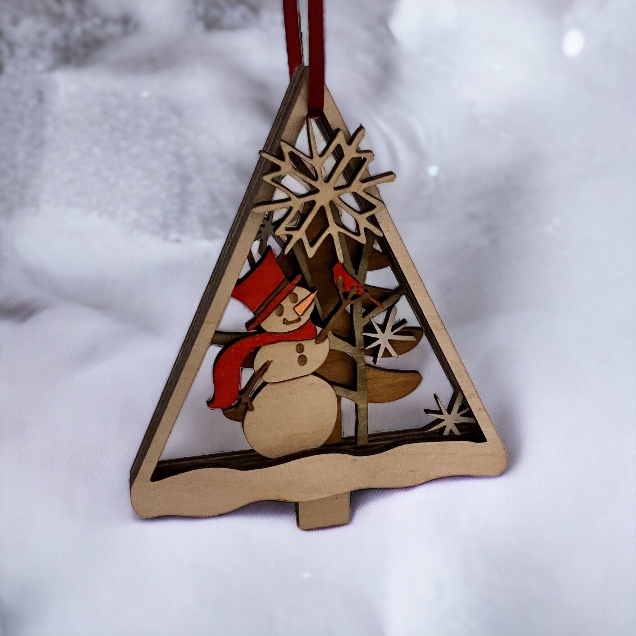 Handcrafted rustic wood holiday ornament with snowflakes