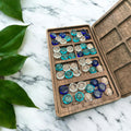 Handcrafted wooden Mancala board with blue glass stones