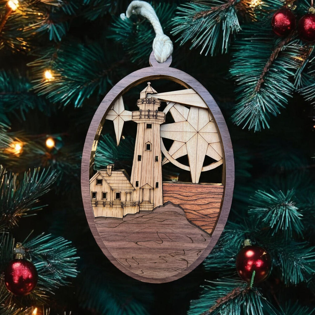 Decorative ornament with a lighthouse design on a Christmas tree.