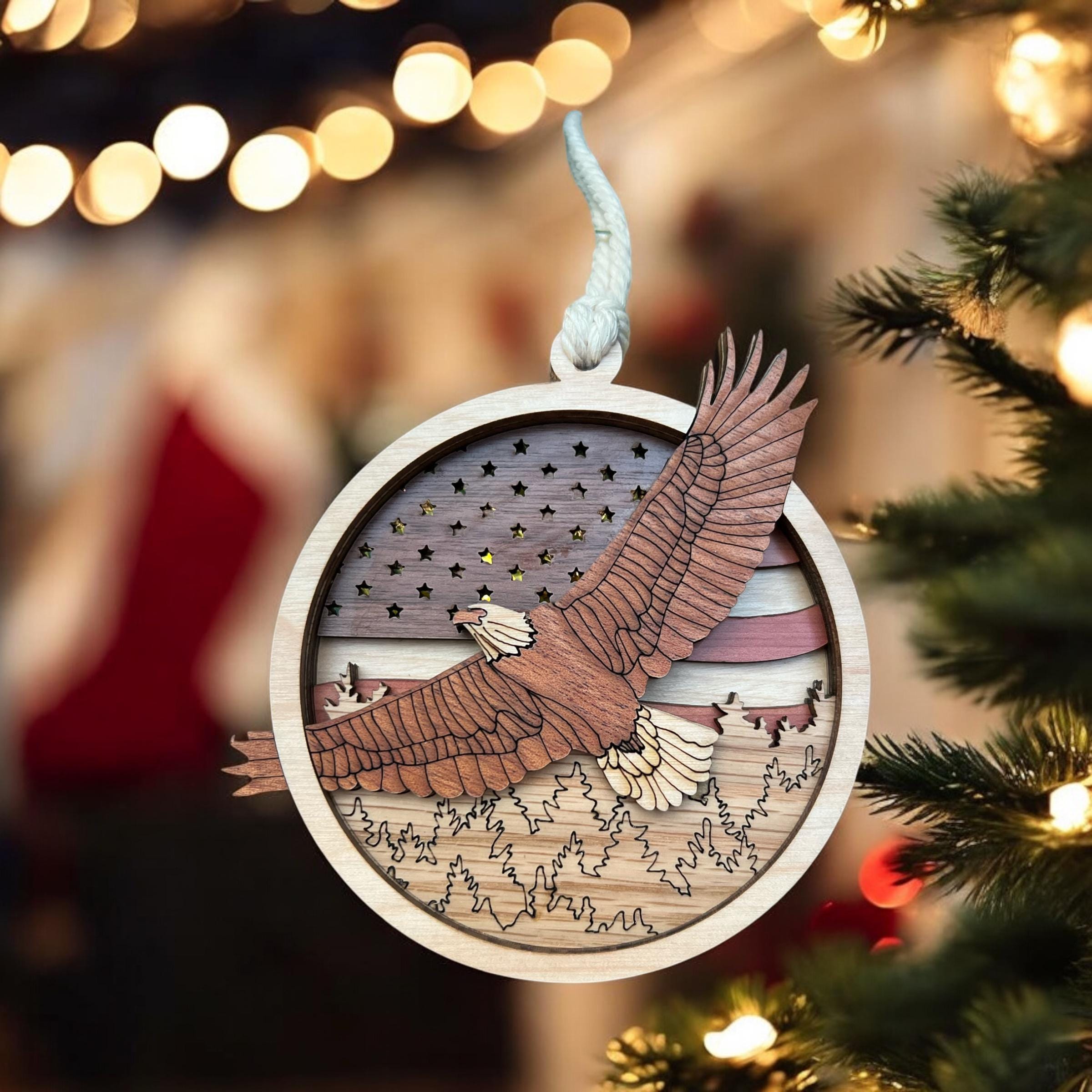 Wooden ornament with eagle design on a Christmas tree