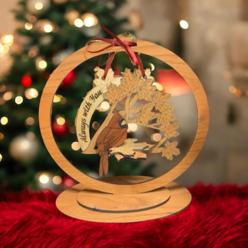 Sympathy gift ornament displayed beside Christmas greenery