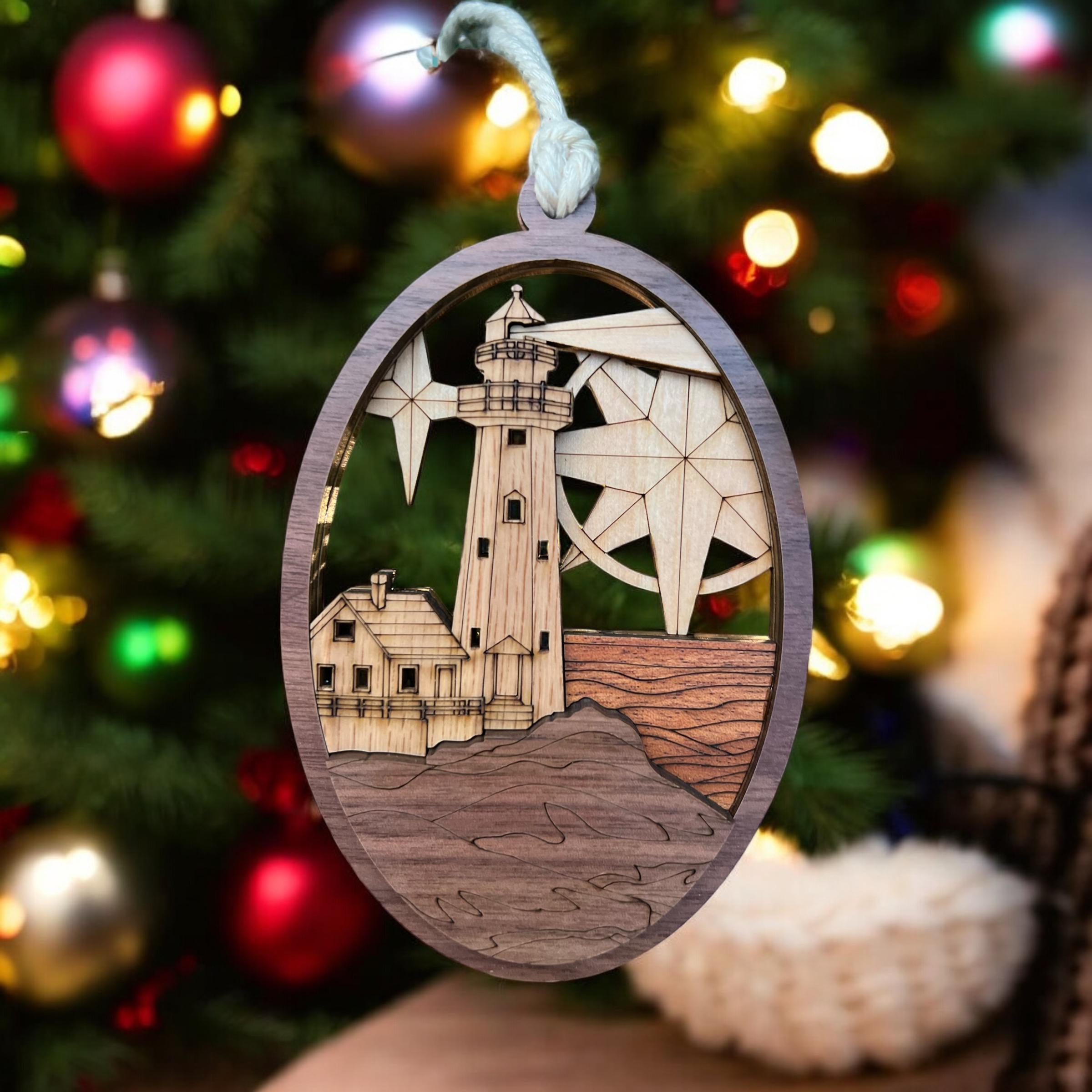 Laser-cut wooden lighthouse ornament with engraved waves and star