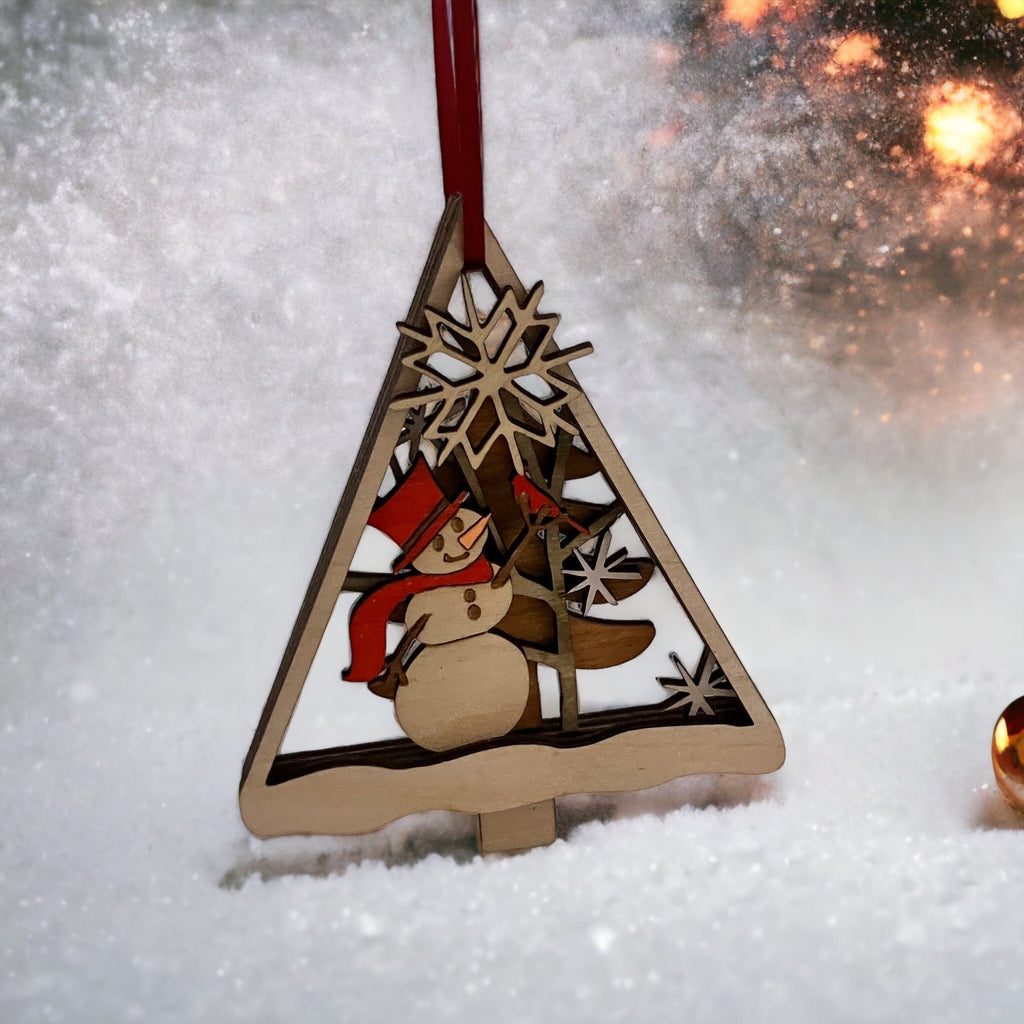 Wooden Christmas ornament with a snowman design on a snowy background