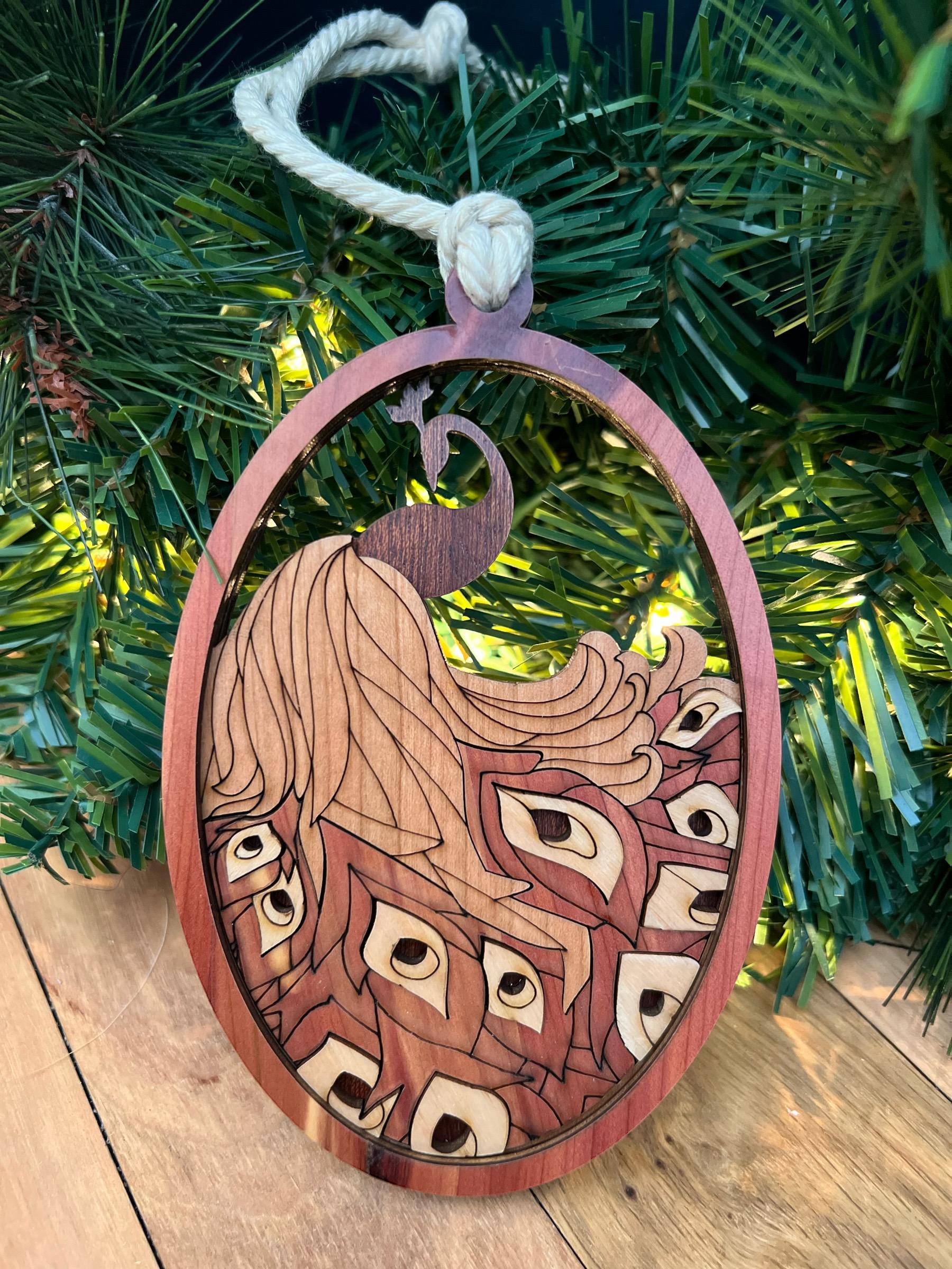 Handmade engraved peacock ornament with natural wood grain