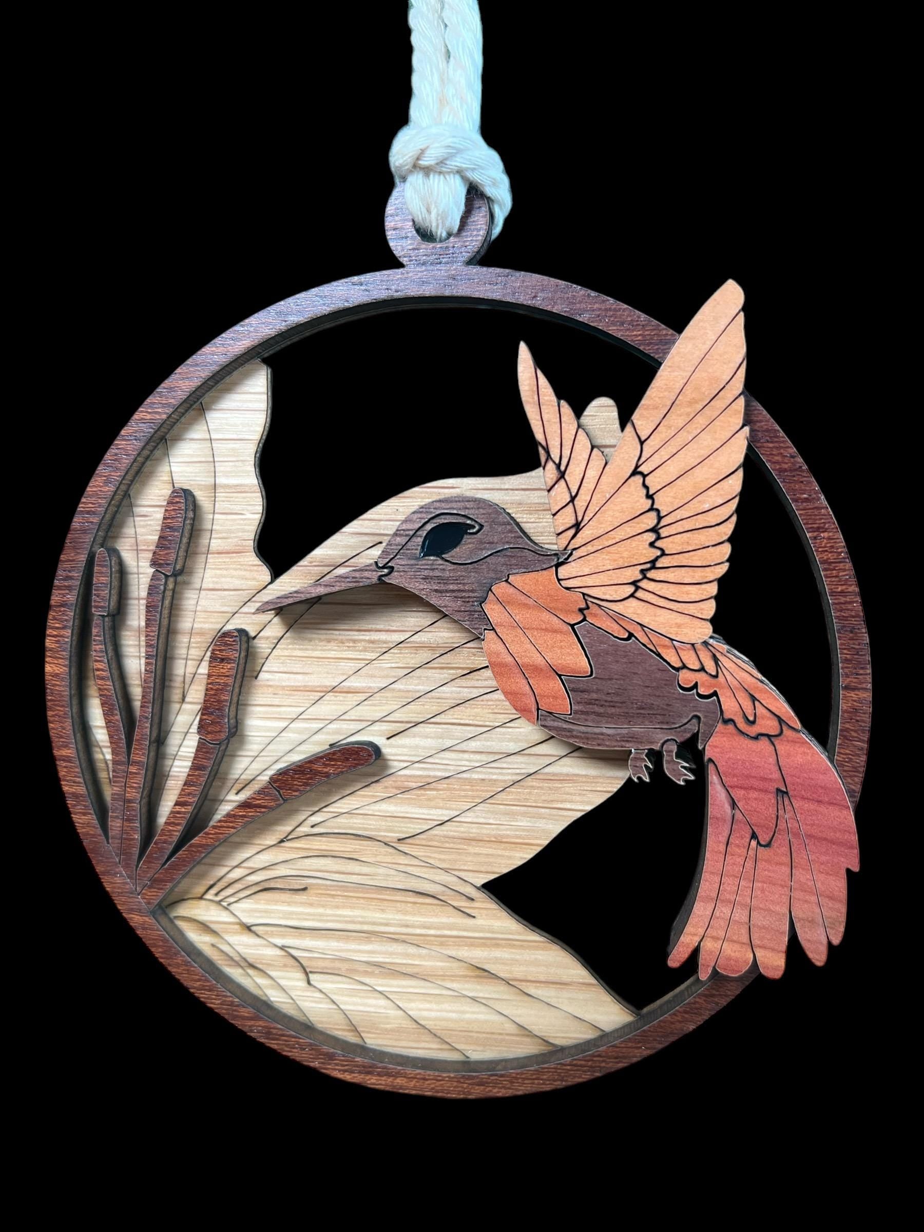 Close-up of natural wood grain hummingbird design