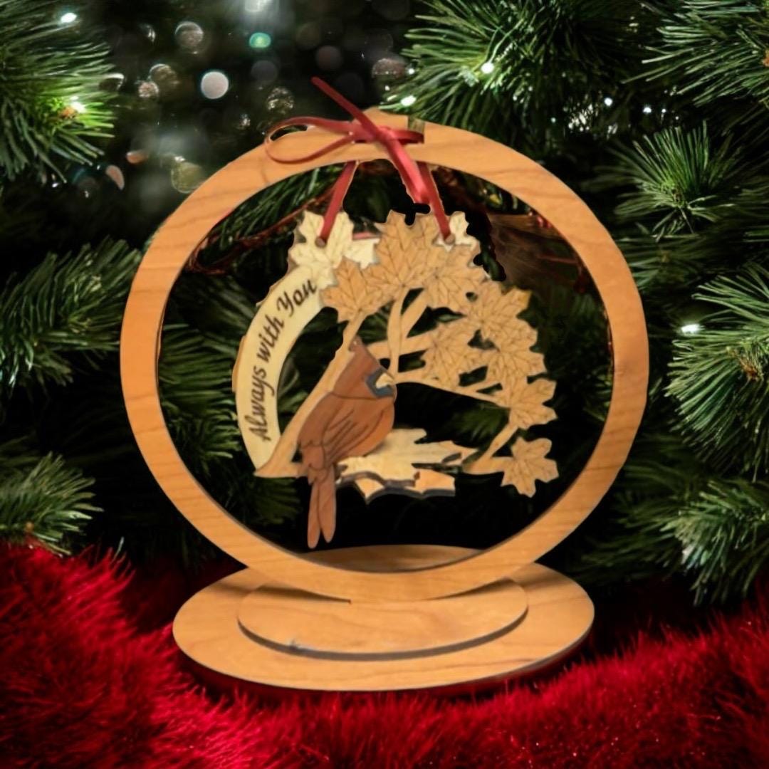 Wooden “Always With You” cardinal ornament by Christmas tree