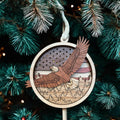 Wooden eagle ornament with American flag background on Christmas tree