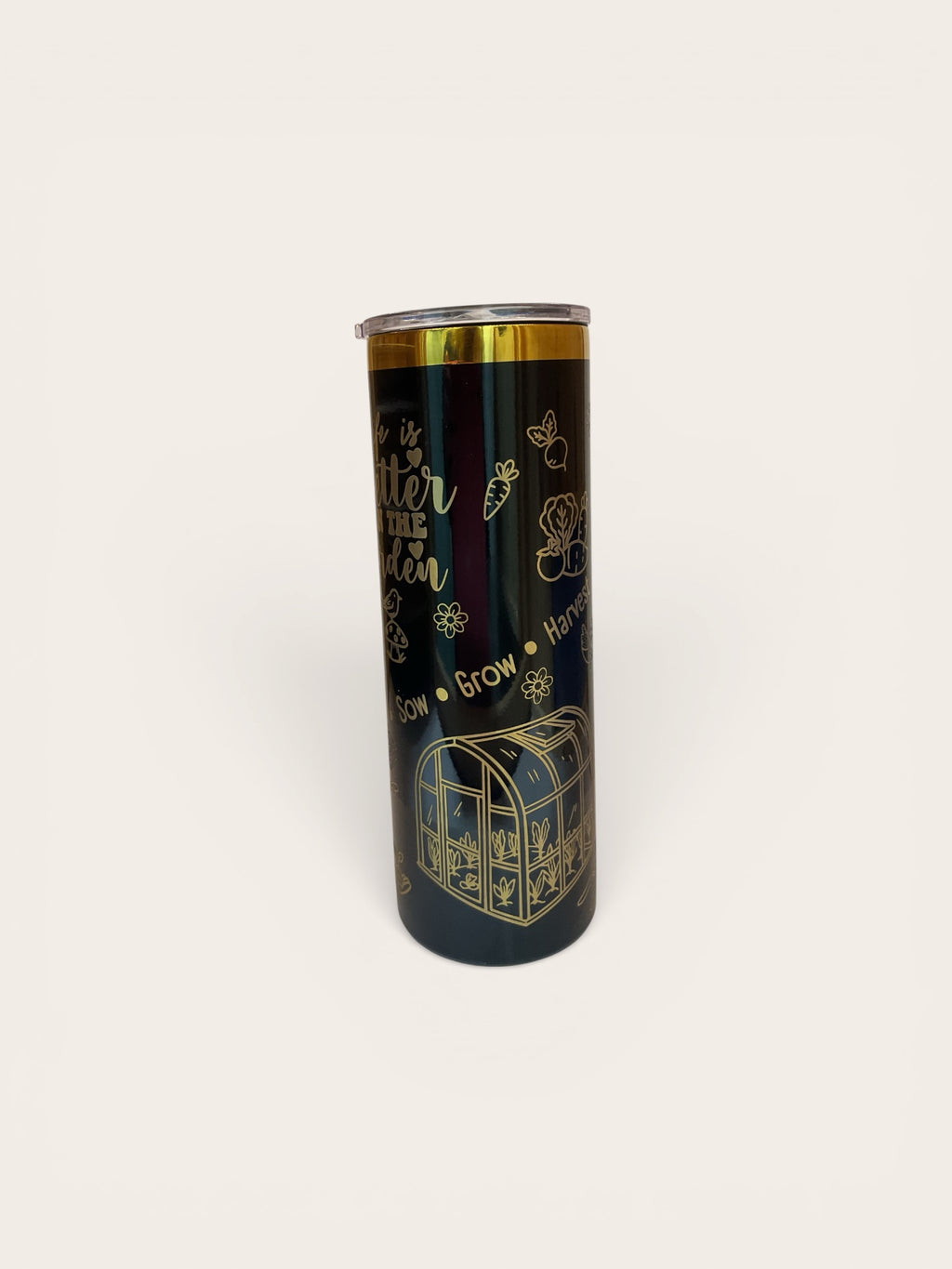 Black tumbler with gold text and designs on a white background