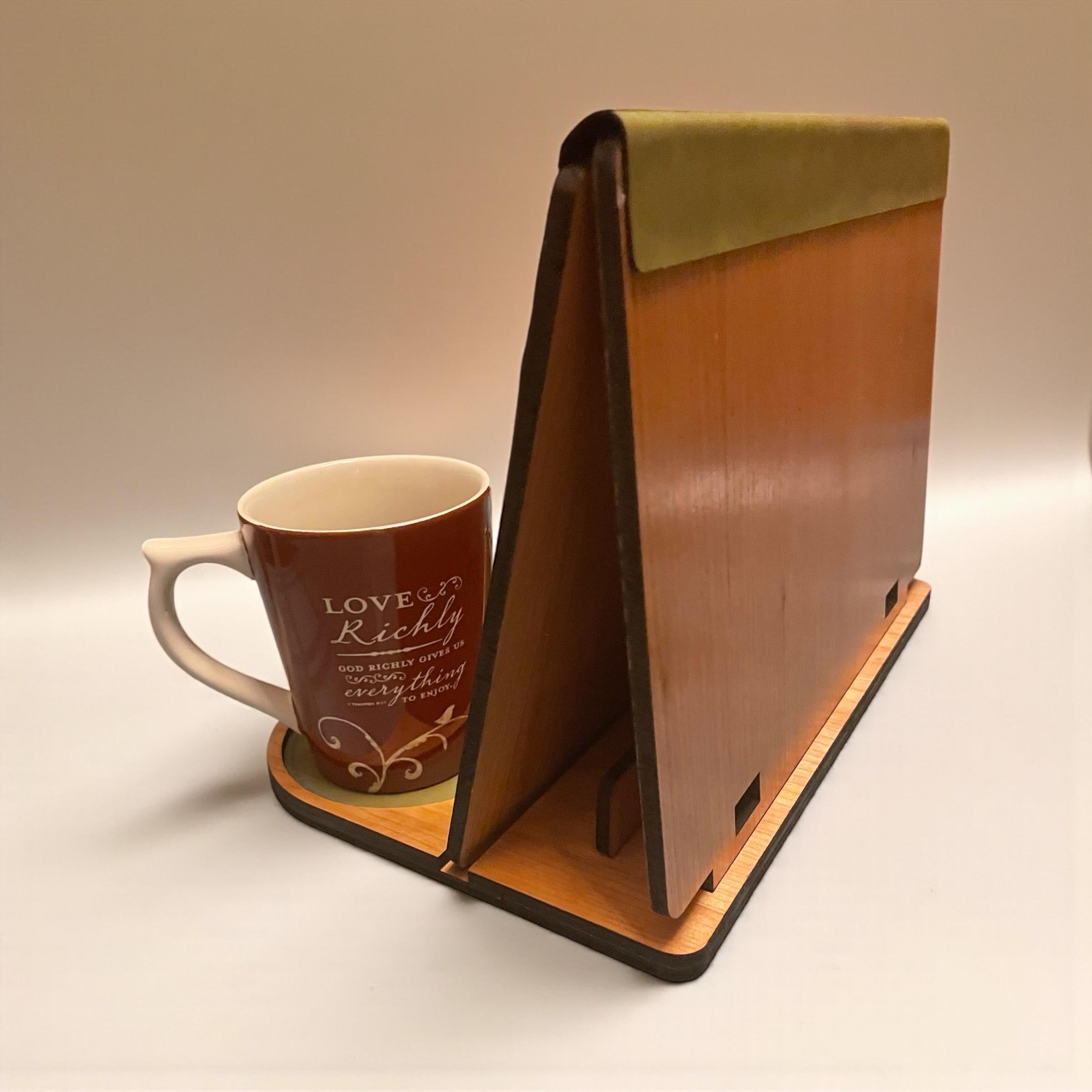 Cozy book nook setup with cherry wood book valet and steaming mug