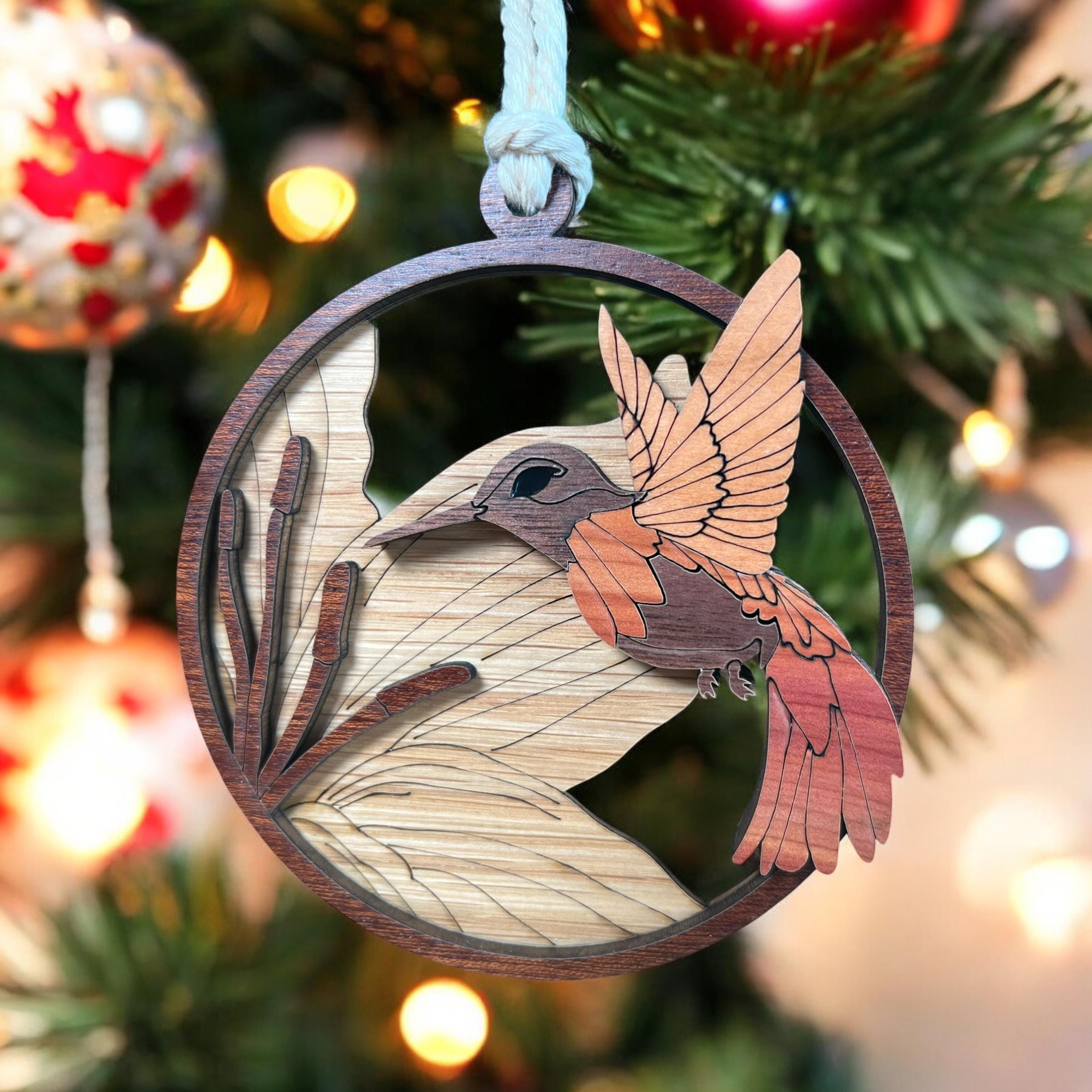 Wooden bird ornament on a Christmas tree with blurred lights in the background