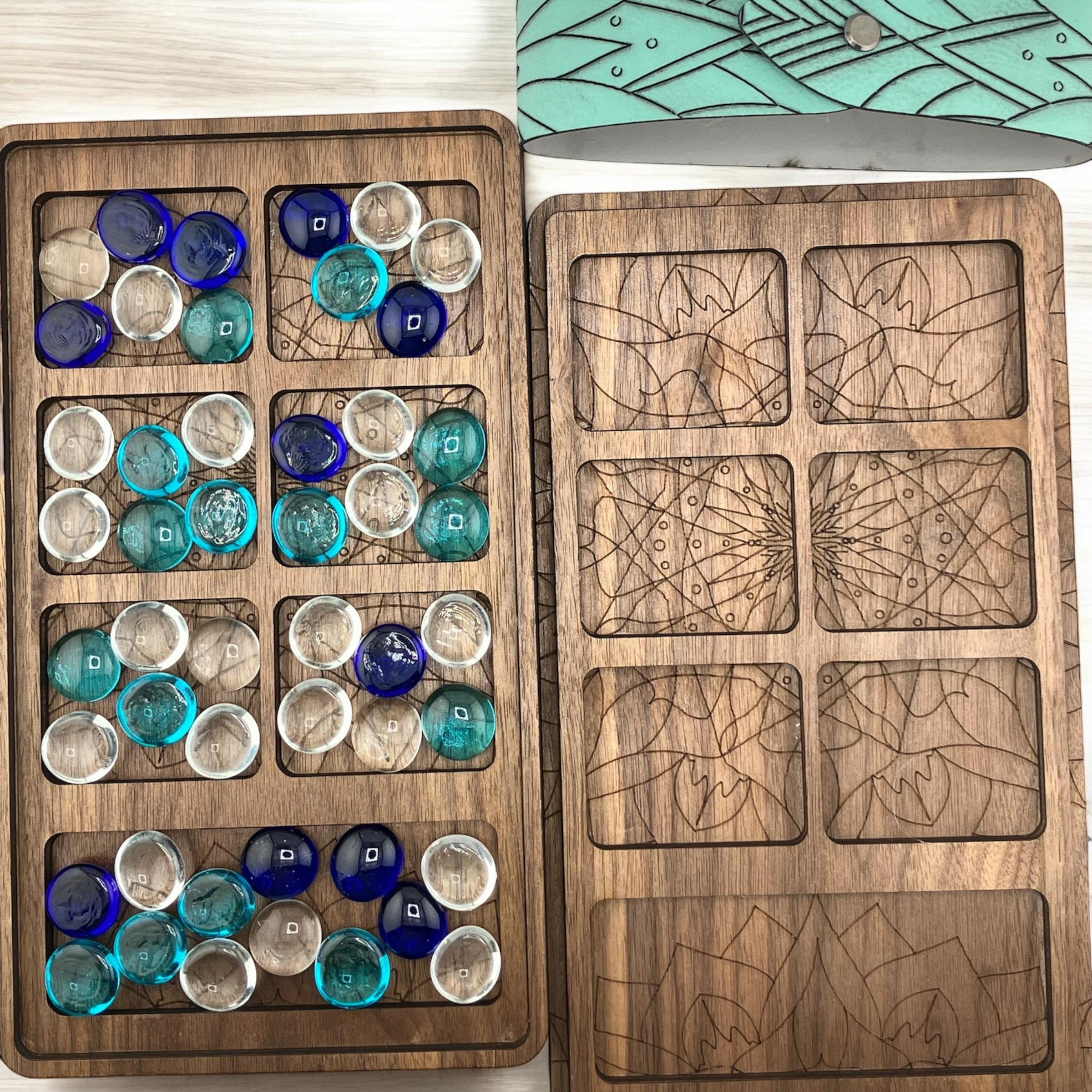 Classic handcrafted Mancala game with engraved design and glass marbles