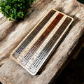 Handcrafted wooden cribbage board with laser-engraved geometric design