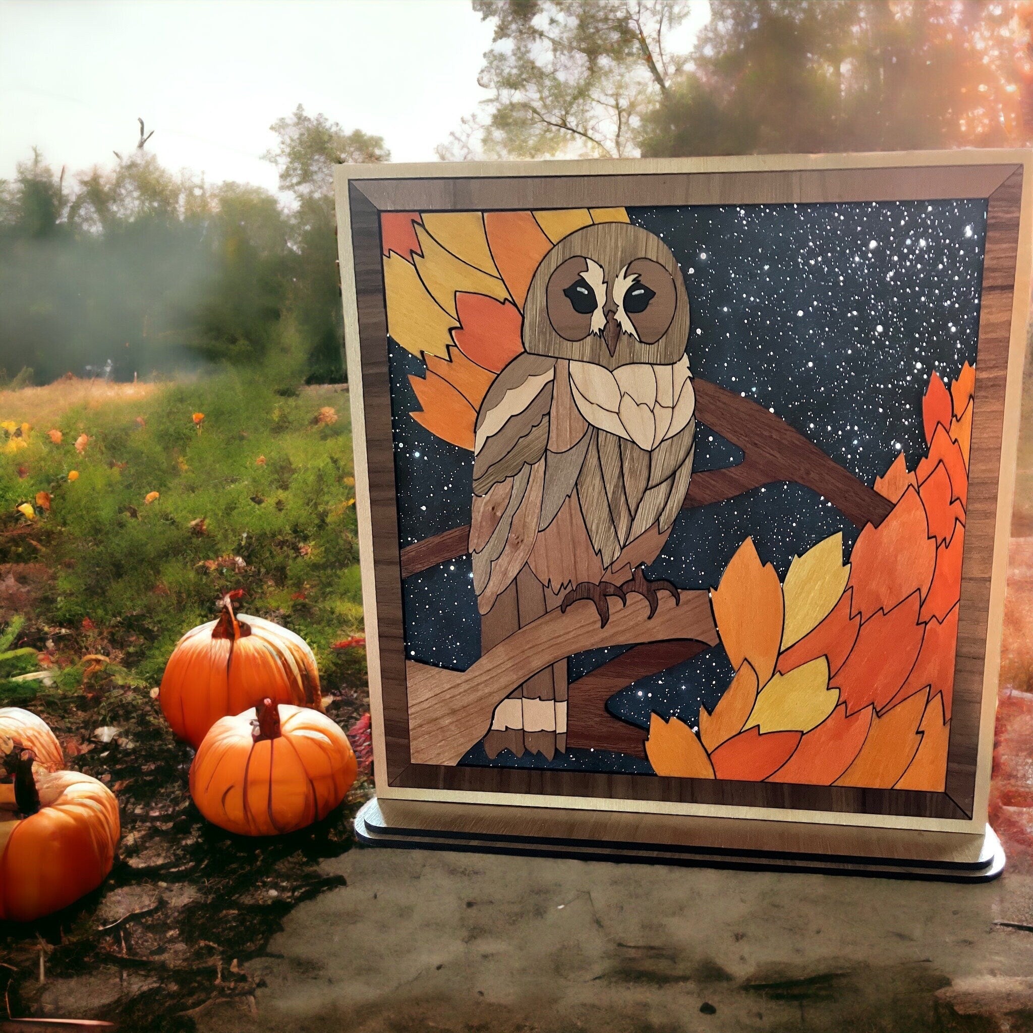 Free-standing wooden owl decor with autumn leaves and night sky