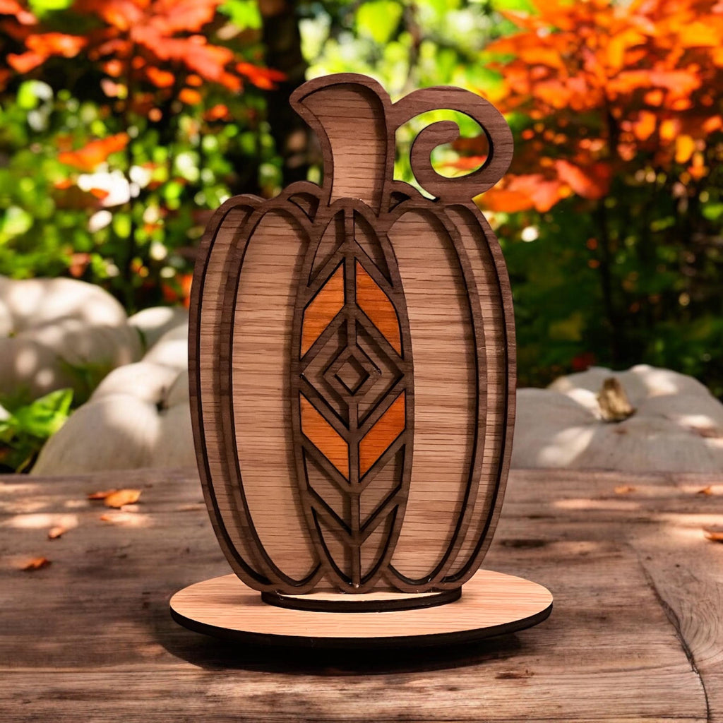 Rustic wooden pumpkin table decor with intricate laser engraved patterns