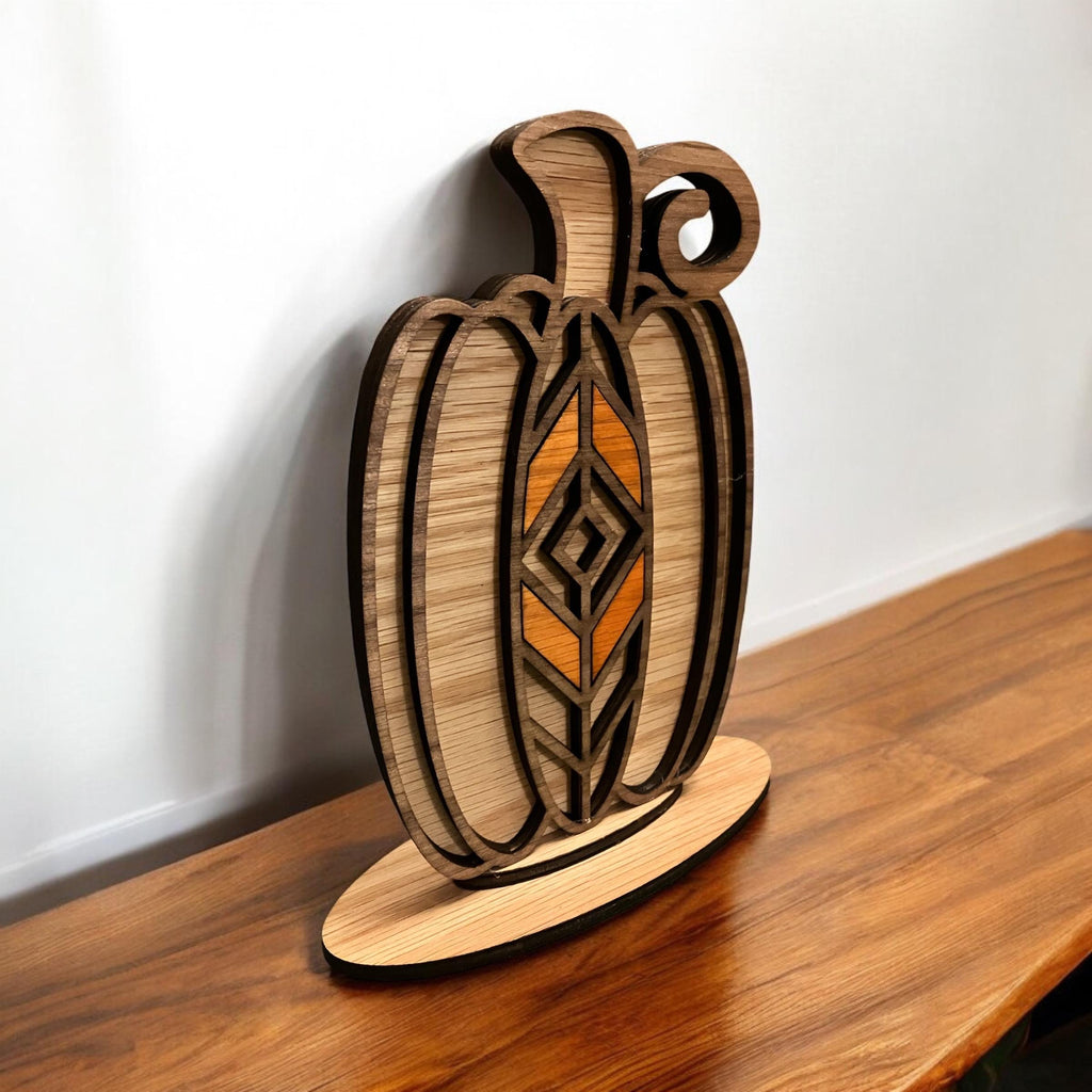 Handcrafted autumn pumpkin decoration made from layered stained wood