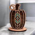 Laser-cut geometric wooden pumpkin décor with teal or orange inlay on round base