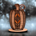 Laser cut layered wood pumpkin with geometric fall design on stand