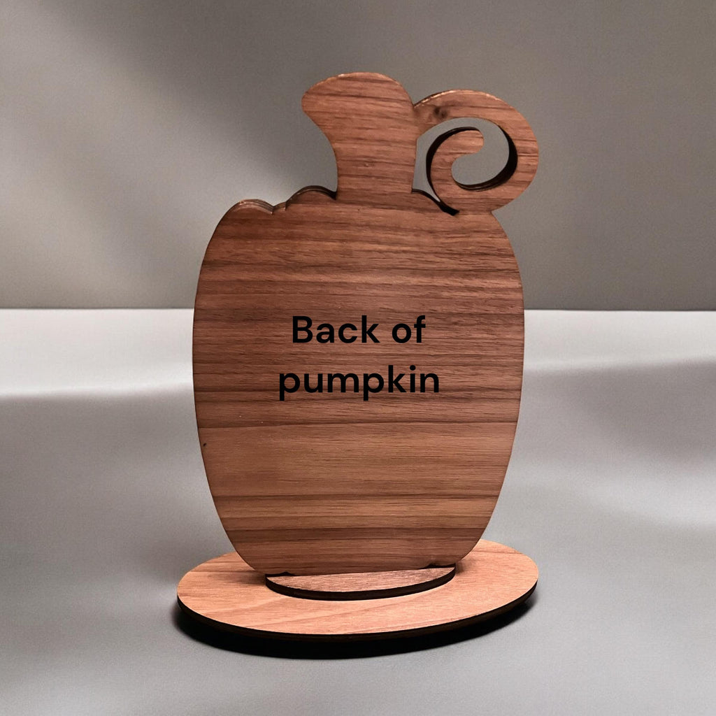 Wooden pumpkin-shaped stand with 'Back of pumpkin' text on a gray background