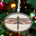 Handmade wooden dragonfly ornament with engraved wings