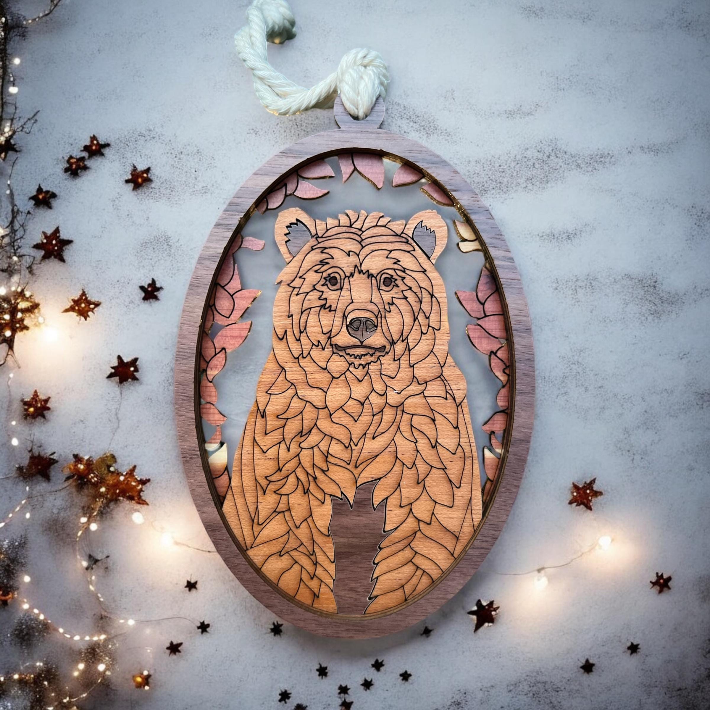Wooden forest animal ornament featuring engraved bear design